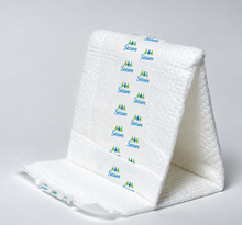 Load image into Gallery viewer, Booster pad folded, showing the soft quilted surface
